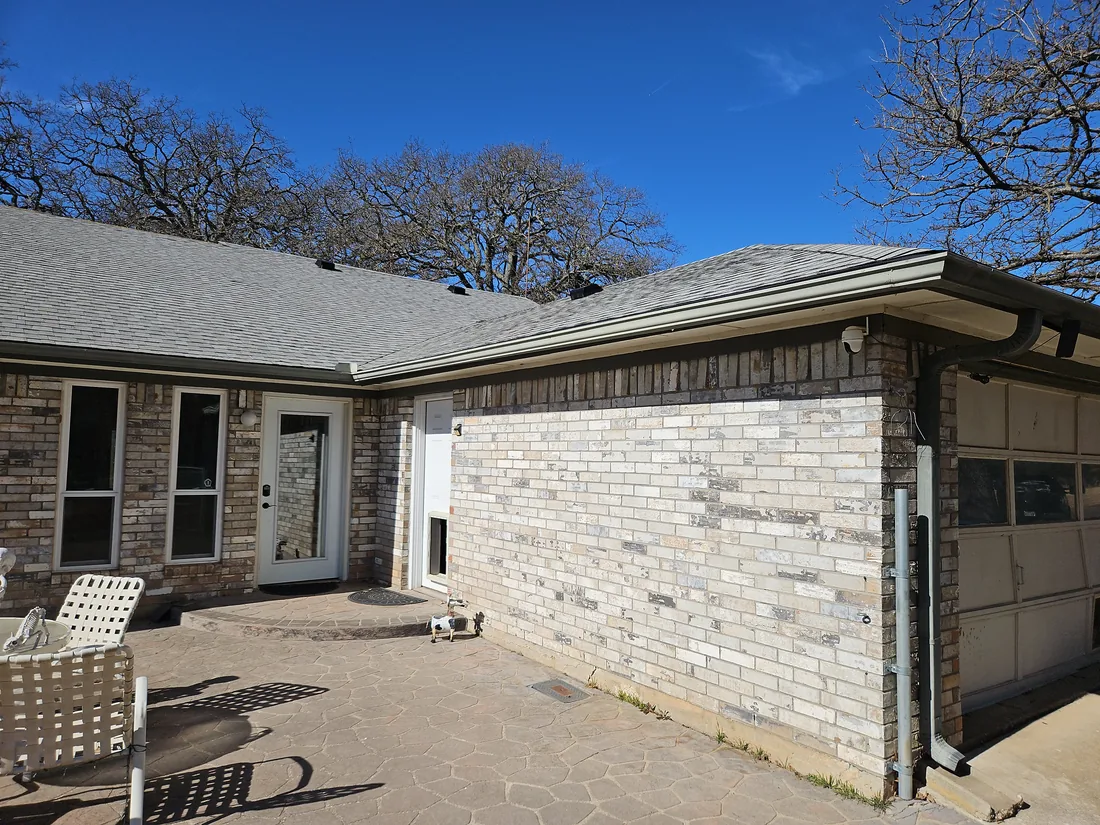 Rear corner of the Collinsville house showing the new roof edge and guttering