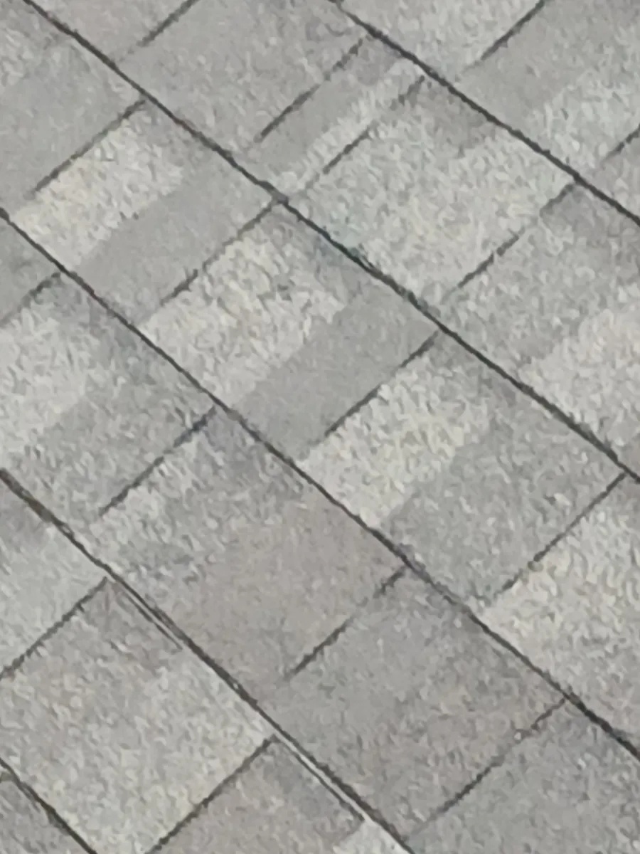 The new shingle courses running across a slope of the Sherman roof