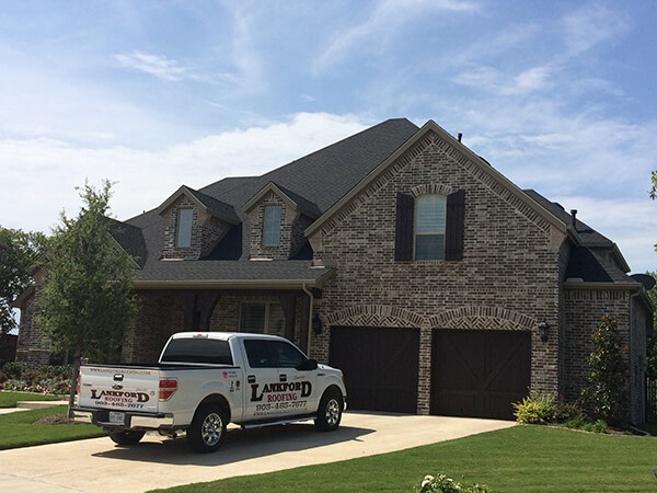 Lankford Roofing crew working on a roof in Sherman TX